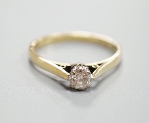 A modern 18ct gold and solitaire diamond ring, size N, gross weight 2.5 grams.